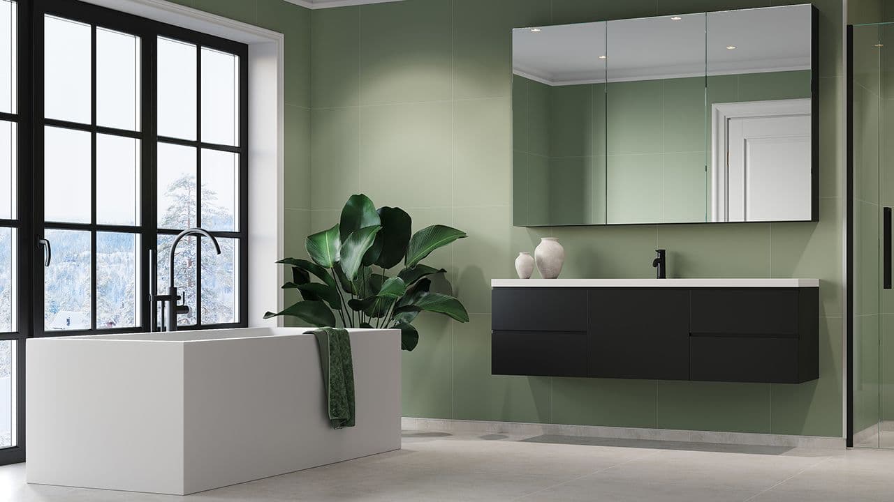 Bad med Olivegreen veggplater, sorte baderomsmøbler og hvitt badekar.